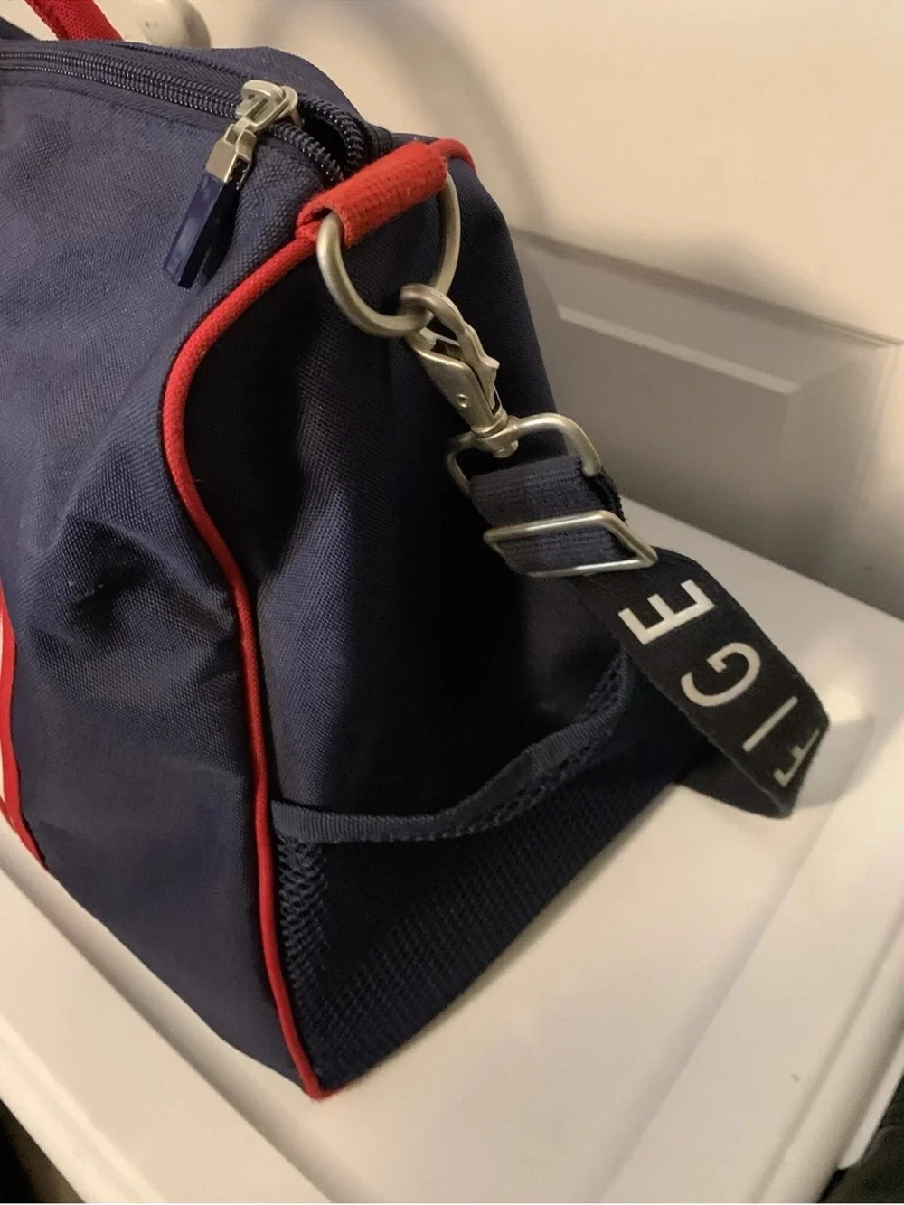 Tommy Hilfiger Navy Duffel with Red Piping and Branded Strap